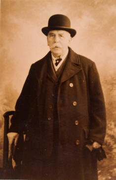 Reuben Beck in bowler hat and coat
