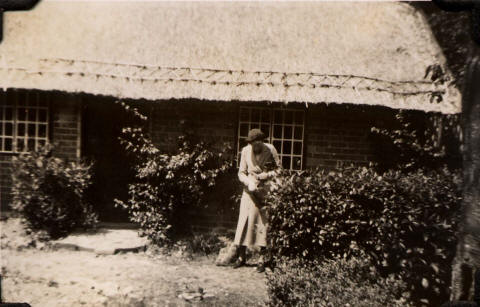 Mary Pollard at the cottage, 1938
